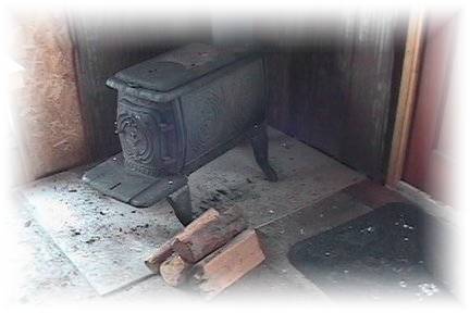 Photo d'un poele  bois dans nos cabanes